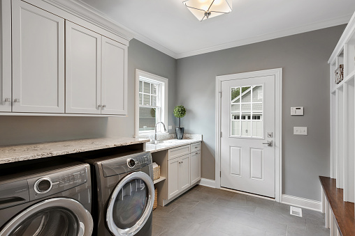 Large front loading washer and dryer in newly built home